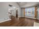 Spacious living area featuring hardwood floors, large windows, and abundant natural light at 905 Freedom Ln, Roswell, GA 30075