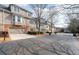 Street view of townhomes featuring attached garages and manicured lawns at 905 Freedom Ln, Roswell, GA 30075