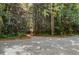 Driveway entrance from road into wooded area at 5635 Lake Forrest Dr, Atlanta, GA 30342