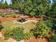 A shaded picnic area and grassy area surrounded by mature trees and landscaping at 5635 Lake Forrest Dr, Atlanta, GA 30342