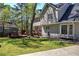 Lovely backyard with a wooden deck, mature trees, and well-maintained lawn, creating a serene outdoor space at 2921 Wickford Nw Dr, Kennesaw, GA 30152