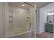 Full bathroom with white subway tile, soaking tub, and tiled floor, providing a relaxing retreat at 2921 Wickford Nw Dr, Kennesaw, GA 30152