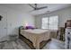 Bedroom with ceiling fan, natural light, and neutral tones at 2921 Wickford Nw Dr, Kennesaw, GA 30152
