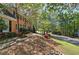 Landscaped front yard view shows the home's location on a tree-lined street at 2921 Wickford Nw Dr, Kennesaw, GA 30152