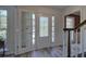 Bright entryway features stylish wood-look floors, a decorative front door and sidelights at 2921 Wickford Nw Dr, Kennesaw, GA 30152