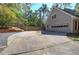 Spacious two-car garage with driveway and fenced yard offer ample parking and outdoor space at 2921 Wickford Nw Dr, Kennesaw, GA 30152