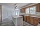 Eat-in kitchen featuring an island and plentiful cabinet space with white appliances at 2921 Wickford Nw Dr, Kennesaw, GA 30152