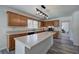 Kitchen with island, modern lighting, and plenty of cabinet space at 2921 Wickford Nw Dr, Kennesaw, GA 30152