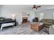 A wide view of a bright and airy living room featuring a brick fireplace at 2921 Wickford Nw Dr, Kennesaw, GA 30152