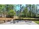 Sport court in backyard with a basketball hoop, perfect for outdoor activities and recreation at 2921 Wickford Nw Dr, Kennesaw, GA 30152