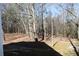 Secluded backyard with mature trees offering privacy and a natural setting at 2100 Indian Shoals Dr, Loganville, GA 30052