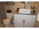 Bathroom featuring a modern vanity with vessel sink, faucet, and toilet at 2100 Indian Shoals Dr, Loganville, GA 30052