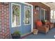Inviting front entrance with a charming blue door, decorative wreaths, and comfortable seating at 2100 Indian Shoals Dr, Loganville, GA 30052