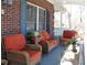 Cozy front porch with wicker furniture, perfect for enjoying the outdoors and relaxing at 2100 Indian Shoals Dr, Loganville, GA 30052