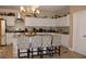 Spacious kitchen with stainless steel appliances, white cabinets, granite counters, and island seating at 2100 Indian Shoals Dr, Loganville, GA 30052