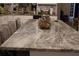 Close up view of a marbled kitchen island with barstool seating at 2100 Indian Shoals Dr, Loganville, GA 30052