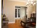Living room featuring hardwood floors, comfortable seating, and french doors to another room at 2100 Indian Shoals Dr, Loganville, GA 30052