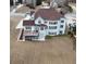 Aerial view of a home featuring a deck, walkout basement, large windows, and a spacious, grassy yard at 4850 Guilford Forest Sw Dr, Atlanta, GA 30331