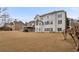 Back exterior of home with a deck and manicured yard, offering ample space for outdoor living at 4850 Guilford Forest Sw Dr, Atlanta, GA 30331