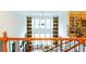 Bright and open living room with soaring ceilings, fireplace, and large windows with decorative drapes at 4850 Guilford Forest Sw Dr, Atlanta, GA 30331