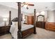 Main bedroom with a large post bed and plenty of room at 1497 Old Draketown Trl, Temple, GA 30179