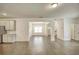 Open-concept living space flowing to kitchen and dining, offering seamless flow and modern appeal at 3201 Camden Ct, Atlanta, GA 30349