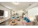 Bright, open-concept living room and kitchen with modern furnishings and neutral tones at 3201 Camden Ct, Atlanta, GA 30349