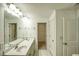 A bathroom featuring double sinks, tile flooring, and a walk in closet at 3201 Camden Ct, Atlanta, GA 30349