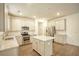 Bright kitchen features white cabinets, stainless steel appliances, granite countertops, and a center island at 3201 Camden Ct, Atlanta, GA 30349