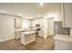 Modern kitchen with stainless steel appliances, granite countertops, and a convenient center island at 3201 Camden Ct, Atlanta, GA 30349