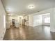 Spacious living room with wood floors, seamlessly flowing into the modern kitchen and dining area at 3201 Camden Ct, Atlanta, GA 30349