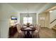 Elegant dining room featuring wainscoting, a chandelier, and a large table with seating for eight at 3201 Camden Ct, Atlanta, GA 30349