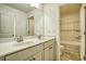 Bright bathroom with double sink vanity and tub with white tile surround at 3201 Camden Ct, Atlanta, GA 30349