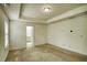 Spacious Primary bedroom featuring tray ceilings and an en-suite bathroom at 3201 Camden Ct, Atlanta, GA 30349