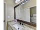 Simple bathroom with granite countertop and large mirror at 8540 Prairie Dunes Way, Duluth, GA 30097