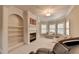 Relaxing sitting room with fireplace and built-in shelving at 8540 Prairie Dunes Way, Duluth, GA 30097