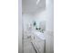 Bright white bathroom featuring updated vanity and marble floors at 1466 Hardin Ave, Atlanta, GA 30337