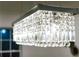 Close-up of a modern chandelier with crystal pendants, offering a touch of elegance and style at 1466 Hardin Ave, Atlanta, GA 30337