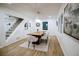 Bright dining room featuring hardwood floors and a modern chandelier above a wooden table at 1466 Hardin Ave, Atlanta, GA 30337
