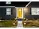 Charming home featuring a walkway and a bright yellow front door for a welcoming entrance at 1466 Hardin Ave, Atlanta, GA 30337