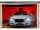 Garage with a white car parked inside, well-lit interior and open doors at 1466 Hardin Ave, Atlanta, GA 30337