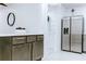 Spacious kitchen featuring gray cabinets, stainless steel fridge and marble countertops for a sleek look at 1466 Hardin Ave, Atlanta, GA 30337