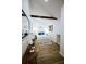 This main bedroom features white walls, hardwood floors, and a vaulted ceiling with a beam at 1466 Hardin Ave, Atlanta, GA 30337