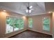 Bedroom boasts recessed lighting, fan, tray ceilings and large windows offering views and natural light at 403 Pebblebrooke Ln, Canton, GA 30115