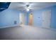 Bright bedroom with blue walls, ceiling fan, and neutral carpet offers a serene and comfortable space at 403 Pebblebrooke Ln, Canton, GA 30115