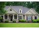 Charming home with manicured landscaping, stone facade, and inviting porch exudes curb appeal at 403 Pebblebrooke Ln, Canton, GA 30115