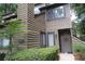 Exterior view of 2 story townhome with landscaping at 102 Cedar Chase Rd, Atlanta, GA 30324