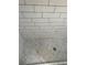 Shower with gray mosaic tile floor and white subway tile surround at 102 Cedar Chase Rd, Atlanta, GA 30324