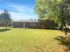 Spacious backyard featuring a large grassy area and a home with brick details at 741 Prince Ave, Marietta, GA 30062