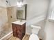 Bathroom featuring tiled shower, modern vanity and fixtures at 741 Prince Ave, Marietta, GA 30062